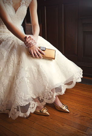 Spring 2012 Allure fitted lace gown with contoured straps that continue to a keyhole back, a chapel-length train and covered buttons. By Allure Bridal, $1,599 at Brides 2 Be, Lewes. Bronze clutch by Nova, $55 at Fantasia Bride, Wilmington. Simon gold shiny snakeprint shoe with covered heel by Kate Spade, $298 at Peter Kate, Greenville. 14-karat white gold radiant-cut diamond with micro-pave diamond shank from the OrStar New Generation Collection, $5,985 at Orly Diamonds, Wilmington