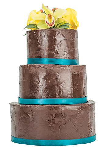 Oh, Fudge!
Double chocolate truffle fudge mousse is glazed in ganache
and topped with fresh flowers. <br>Nage Catering, 19730 Coastal Hwy., Rehoboth Beach, 226.2037, nagerb.com