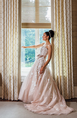 Nice View
This strapless dress by David Tutera for Mon Cheri Bridals features a Venise lace bodice with an organza ribbon band accented with a side bow, $1,236, Claire’s Fashions, Wilmington; Pearl drop earrings by Erica Koesler, $89; head band with pearls and Swarovski crystals, $259, both from Brides 2 Be by Hope Mitchell, Lewes; 1.63-carat diamond with 14-karat white gold band, $8,690, Bellinger’s Jewelers, Rehoboth Beach