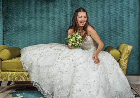 Fully embellished with embroidery and Swarovski crystals, this strapless ballgown-style dress has a sweetheart neckline and fitted bodice, from Couture's Allure collection, $4,880, at Brides 2 Be by Hope Mitchell, Lewes; One-carat Princess-cut diamond ring in 14-karat white gold displays 0.42 carats of diamonds on the side, $6,850, at Bellinger's Jewelers, Rehoboth Beach; Bouquet of ornithogalum, dianthus, trachelium, tulips, roses, hypericum berries and mini-ferns by Bloomsberry Flowers, Wilmington.