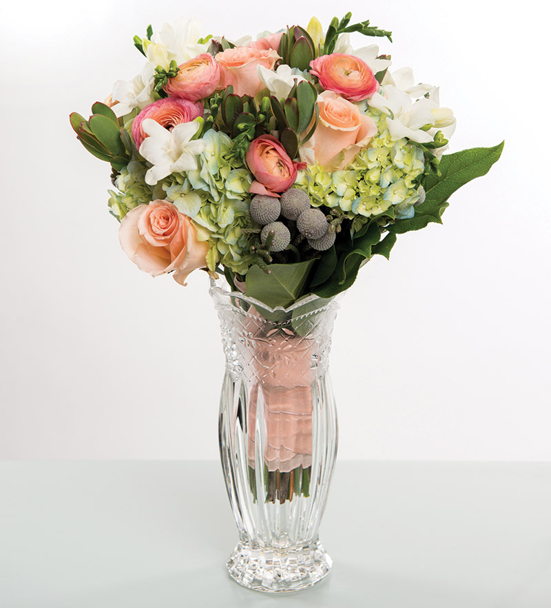 Peach roses and snorkel blue hydrangeas from Bloomsberry Flowers in Wilmington, Del.