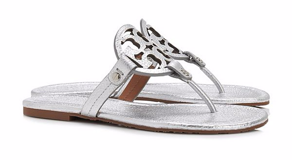 Tory Burch Miller Sandal, Metallic Leather. $195. Available at <a href"https://www.toryburch.com/miller-sandal--metallic-leather/50008679.html?dwvar_50008679_color=040&cgid=shoes-sandals&start=50">Tory Burch</a>.