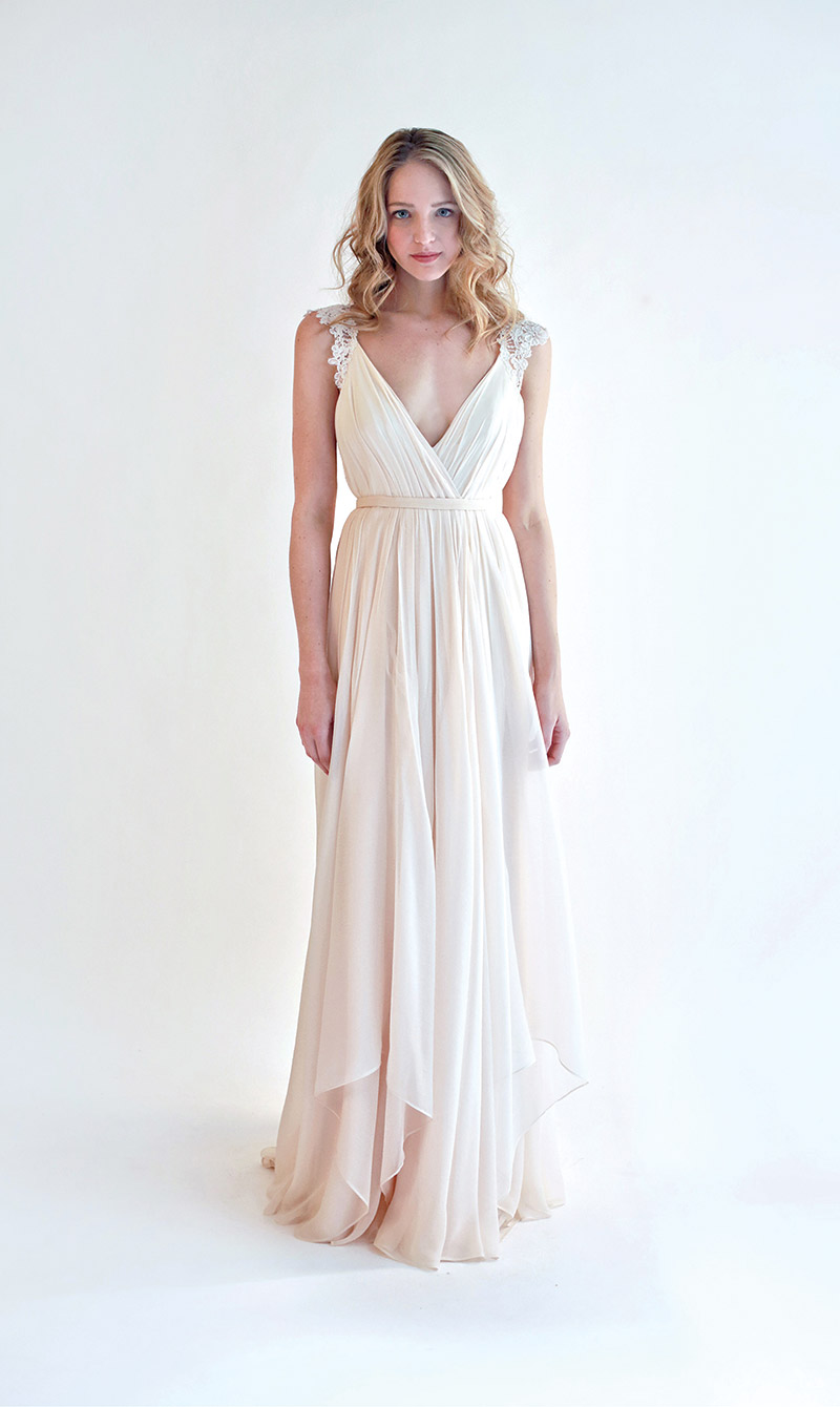 Leanne Marshall Style Lana: This light blush chiffon gown is ethereal, and will stop traffic from the front and the back. The ivory French lace straps add a delicate touch. Sample gown, size 10, priced at $1,850 (originally $3,690) at Sabrina Ann Couture, West Chester. 
