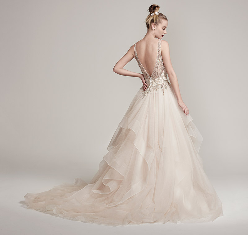 Maggie Sottero Midgley-Amelie: Dione organza creates the dramatic Amelie ball gown with horsehair layered skirt, featuring a bodice adorned with Swarovski crystals and pearls, plunging V-neckline and back. $2,249 at Brides 2 Be By Hope Mitchell.  