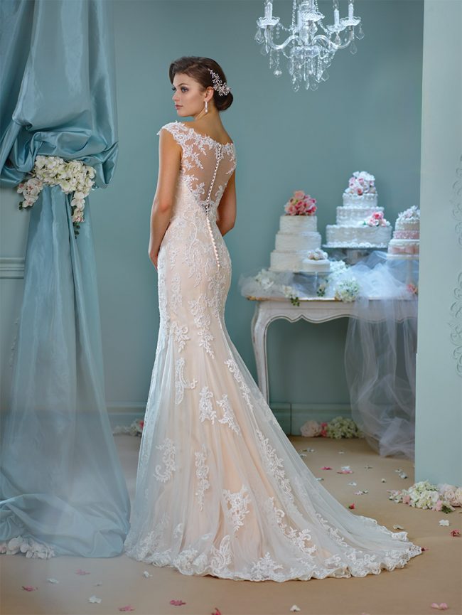  Enchanting by Mon Cheri Style 216159: Ivory/spun gold tulle gown with cap sleeves, lace back, scalloped hemline and chapel-length train. $920 at Occasions Boutique. 