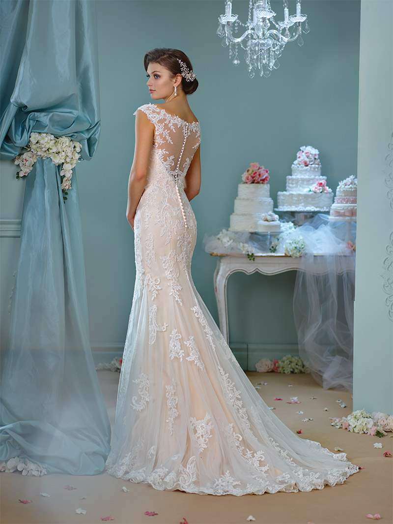 Enchanting by Mon Cheri Style 216159: Ivory/spun gold tulle gown with cap sleeves, lace back, scalloped hemline and chapel-length train. $920 at Occasions Boutique. 