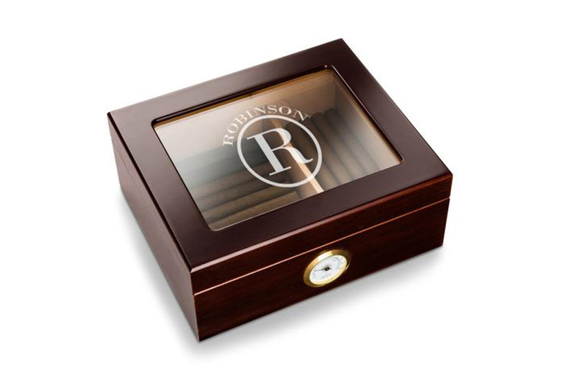 This mahogany Capri glass top humidor is an elegant gift. Add some cigars to complete the package. 
$52.79, www.agiftpersonalized.com
