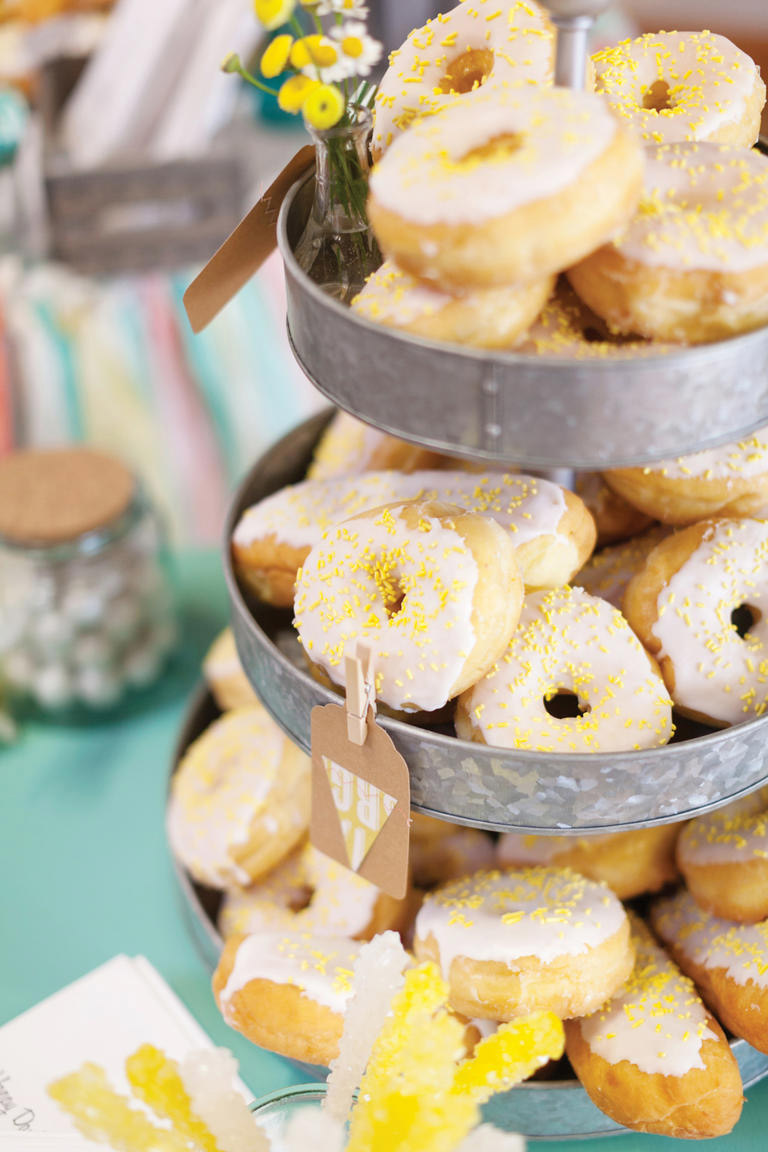 <strong>Donut Tower</strong>
A donut tower is an easy and tasty alternative that is sure to be a crowd pleaser. This DIY wedding in Edwardsville, Ill. chose a yellow theme to coordinate with the flowers on the grooms suit. 