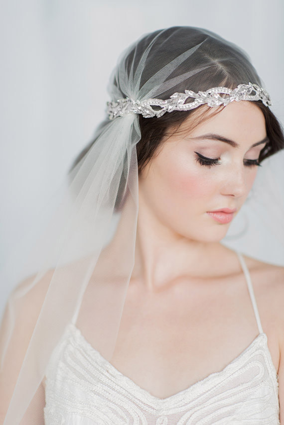 To veil or not to veil? A wedding look completed with the romantic headdress known as the Juliet cap, like this one from Blair Nadeau Millinery, will certainly not end in tragedy.