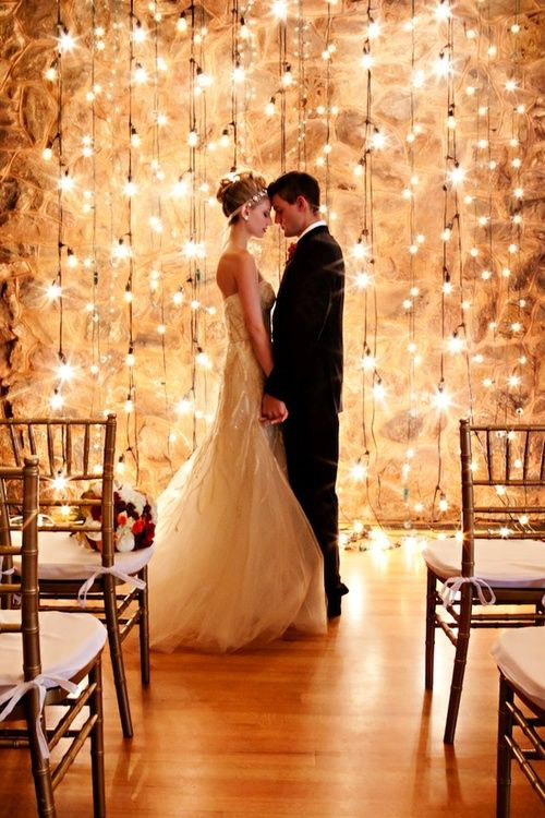 <strong>Bistro lights</strong>   
For non-church nuptials, dress up the alter with lights for a pretty “I do.” 
