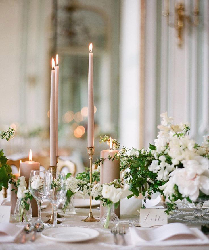 <strong>Taper candles</strong> 
Tall, thin candles adorn the church aisle with class and rustic charm. They are understated and perfect for any wedding theme or venue. 
