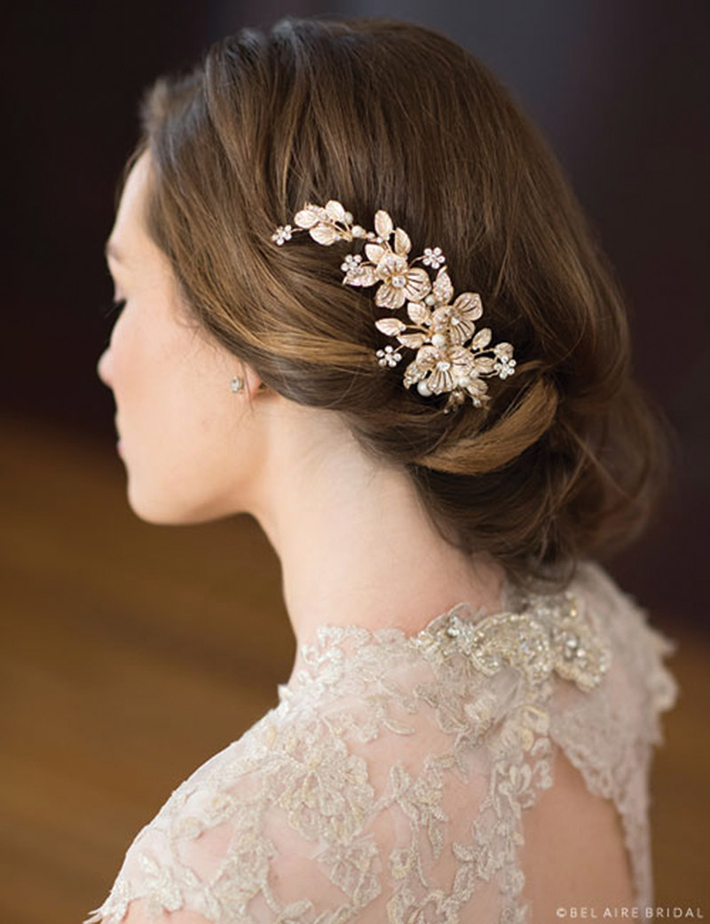 Embrace a gilded flower comb studded with glorious rhinestone accents. Bel Aire Bridal Style 6672, $129, www.clairesfashions.net, Claire’s Fashions, Wilmington, Del.