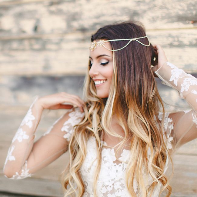 Try this boho-chic inspired look by
adding a jeweled vintage head chain. Haute Bride Style HB116, $395, Jennifer’s Bridal, Hockessin, Del. 