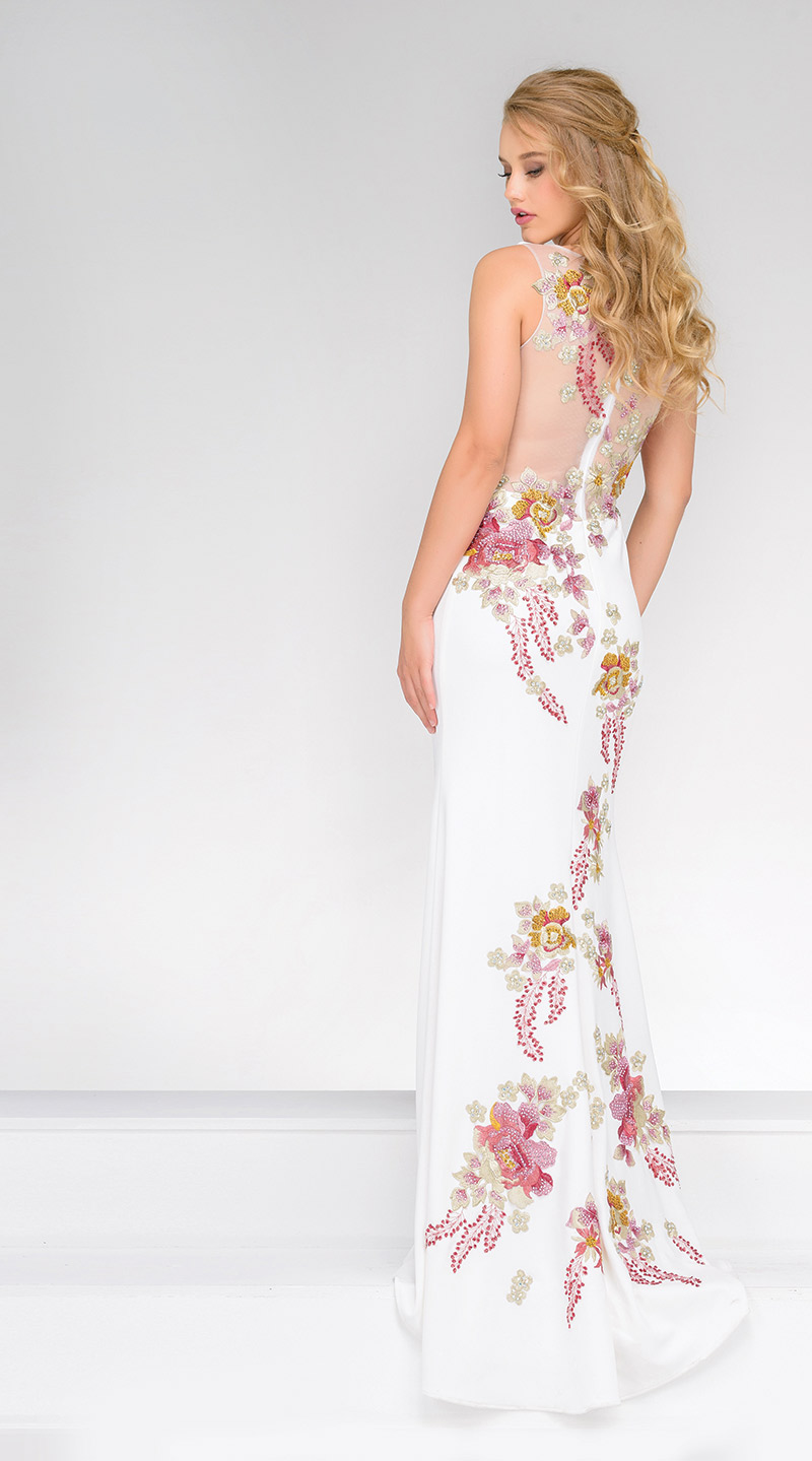. (Jovani Style 33679) Beautiful embroidered jersey dress with intricate work. This ivory floral dress features a high neckline, an embroidered floral design accessorized with rhinestones, a sheer back and short train. $560, Occasions Boutique, Malvern, Pa., www.occasions-boutique.com
