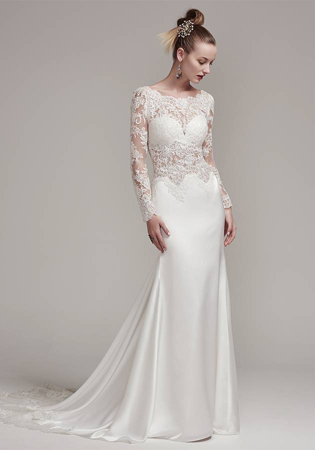 Sottero and Midgley – Fiona Rose | An illusion lace crop top is accented with a stunning scalloped lace bateau neckline and long sleeves. The matching Orlando satin sheath skirt with lace trim creates a fashion-forward two-piece wedding dress style. $1,429, Brides 2 Be by Hope Mitchell, Rehoboth, Del., www.brides2bebyhope.com