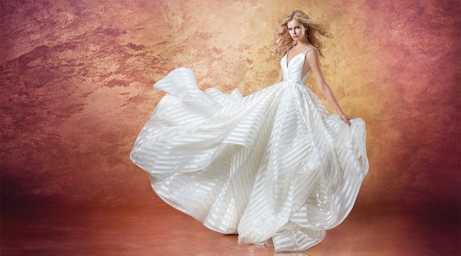Hayley Paige Style Decklyn | This anything-but-ordinary ball gown is modern and playful. The ballerina bodice pairs perfectly with the full cascading skirt. $2,860, Jennifer’s Bridal, Hockessin, Del., jennifersbridal.com