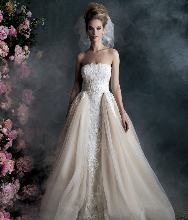 Allure Couture Style C400 | The elegant sweep of this layered ball gown is richened by delicate embroidery. $3,260, Claire’s Fashions, Wilmington, Del., www.clairesfashions.net