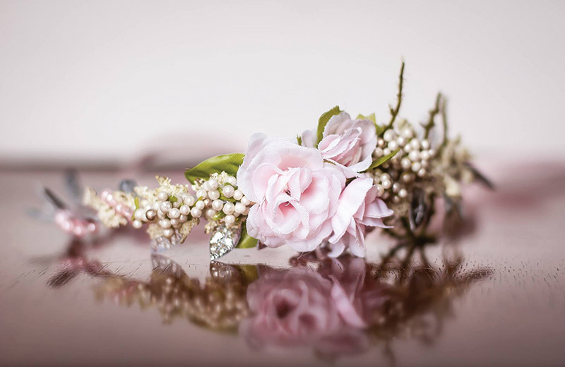 This crown is perfect for a summer wedding. The beads and satin glimmer against the blush rosette. Wedding Crown, $34, Little Lady Accessory, Smyrna, Del. 