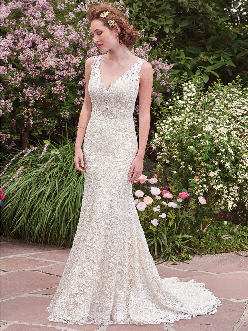 (Rebecca Ingram by Maggie Sottero Style Hope) This vintage-inspired gown boasts a subtle allover-lace fit-and-flare fit and features an illusion plunging neckline and scalloped edging. $899, Brides 2 Be by Hope Mitchell Rehoboth, Del., www.brides2bebyhope.com 